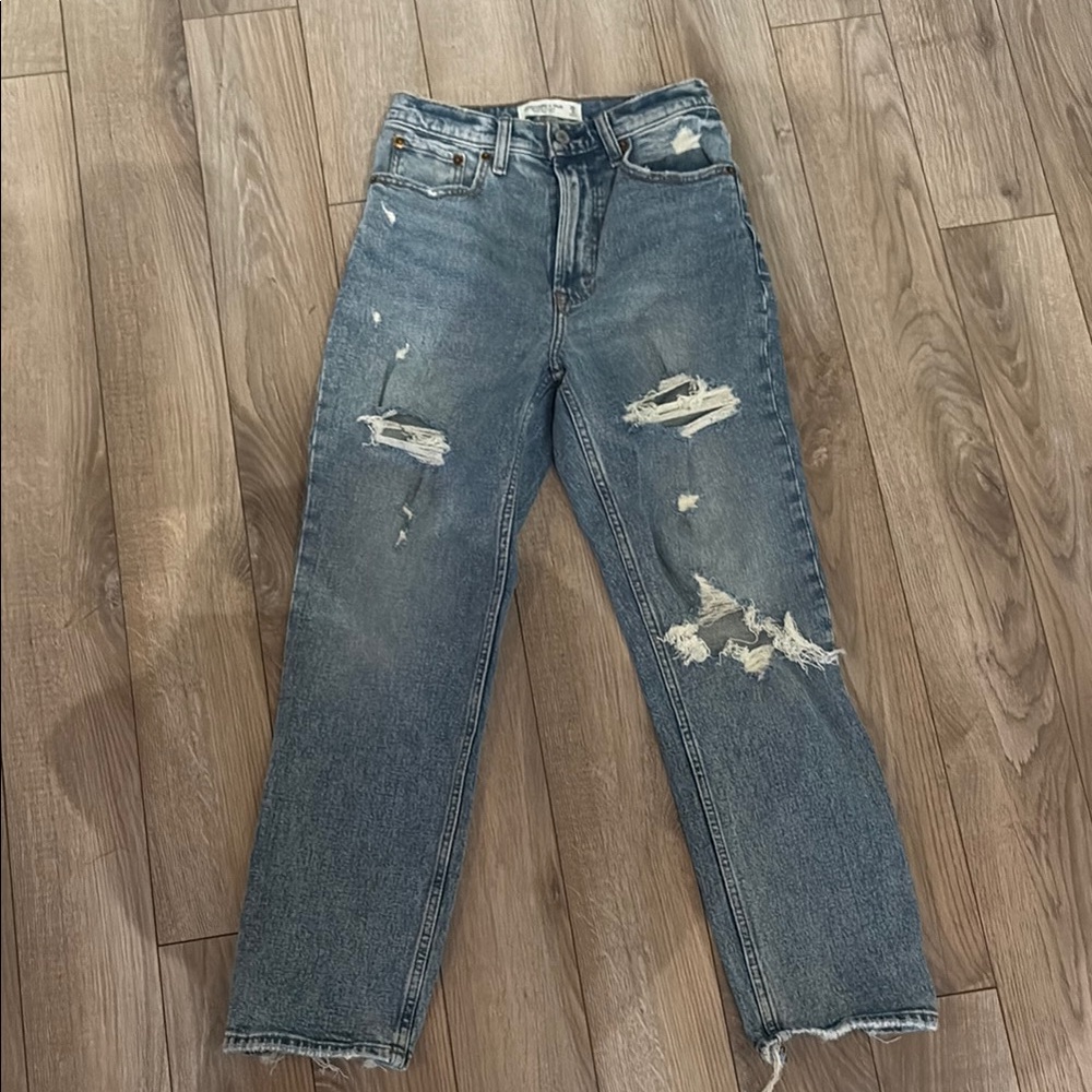 Blue Straight Leg Distressed Jeans with Raw Hem and Fading